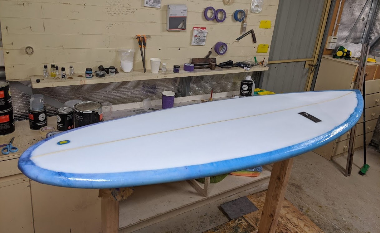 Hot coating a surfboard blank